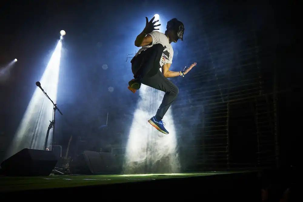 Artist with spotlight on stage
